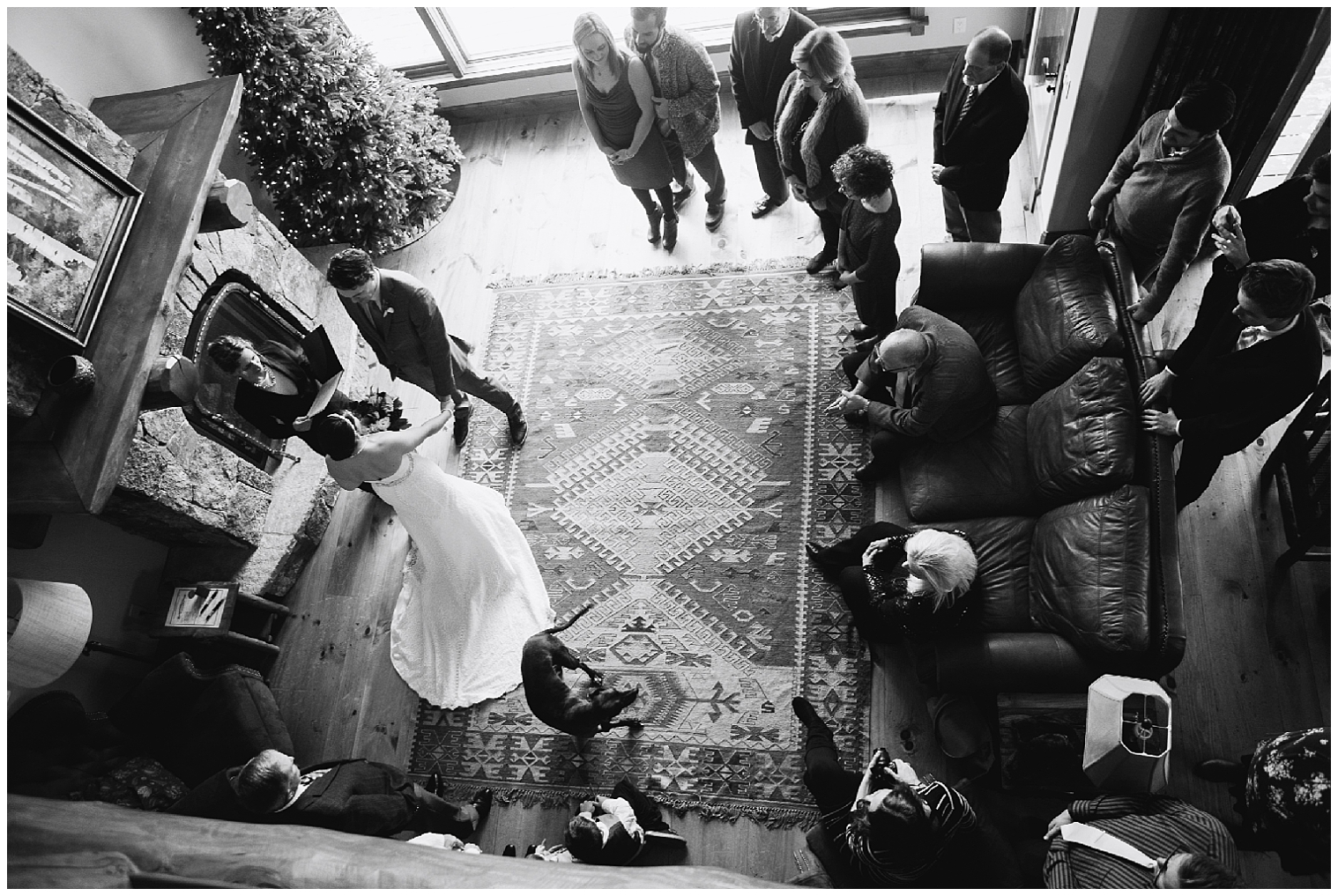 Arial view of a Breckenridge elopement ceremony, in a cabin with family looking on.