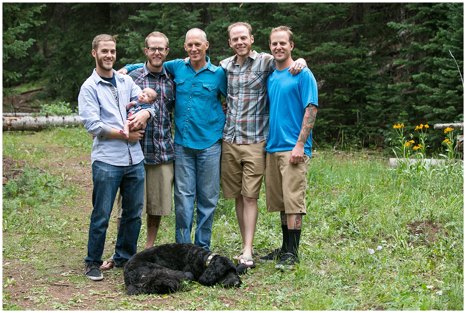 The young men of the family pose together with a baby at an extended family photo shoot in Breckenridge.