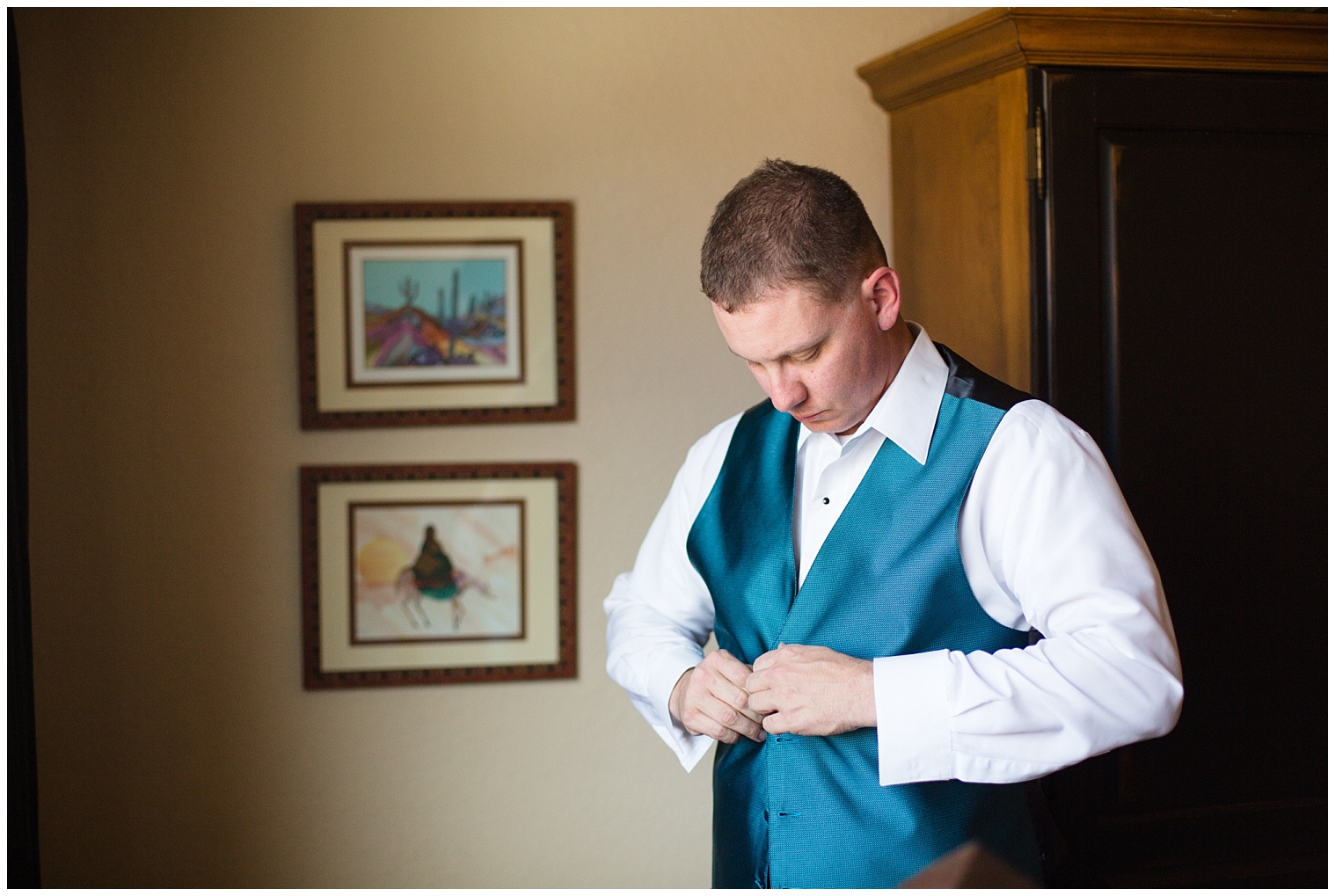 Groom in a blue vest getting ready for his Breckenridge elopement.