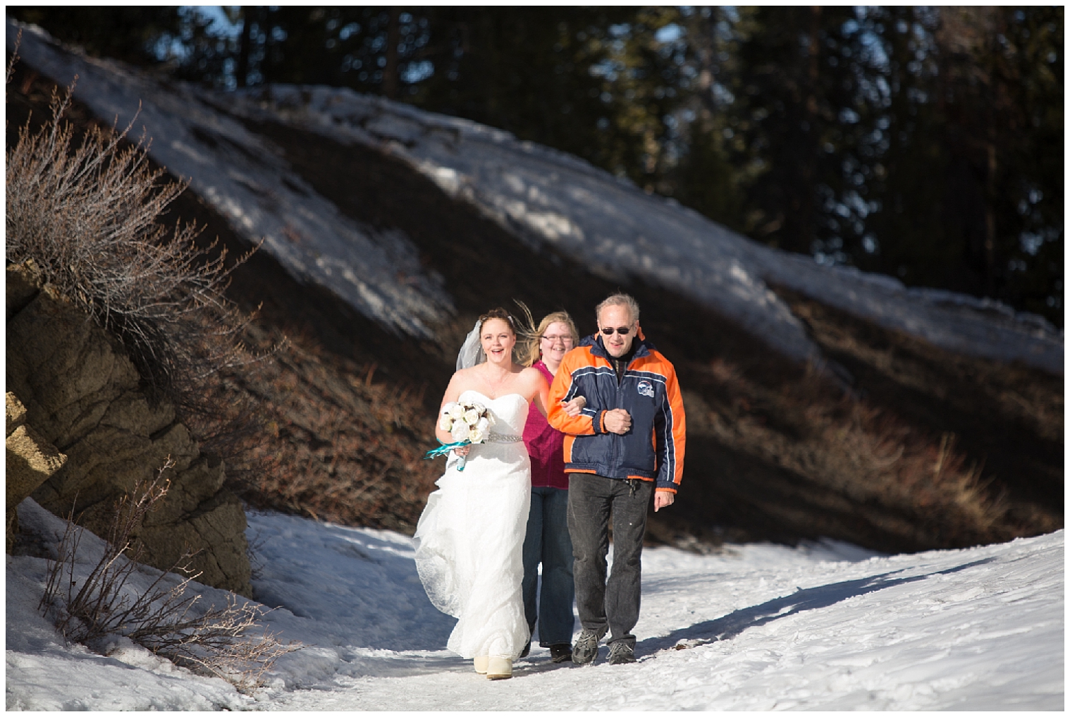 Bride is walked towards her groom by her father at her Breckenridge Colorado mountain elopement.