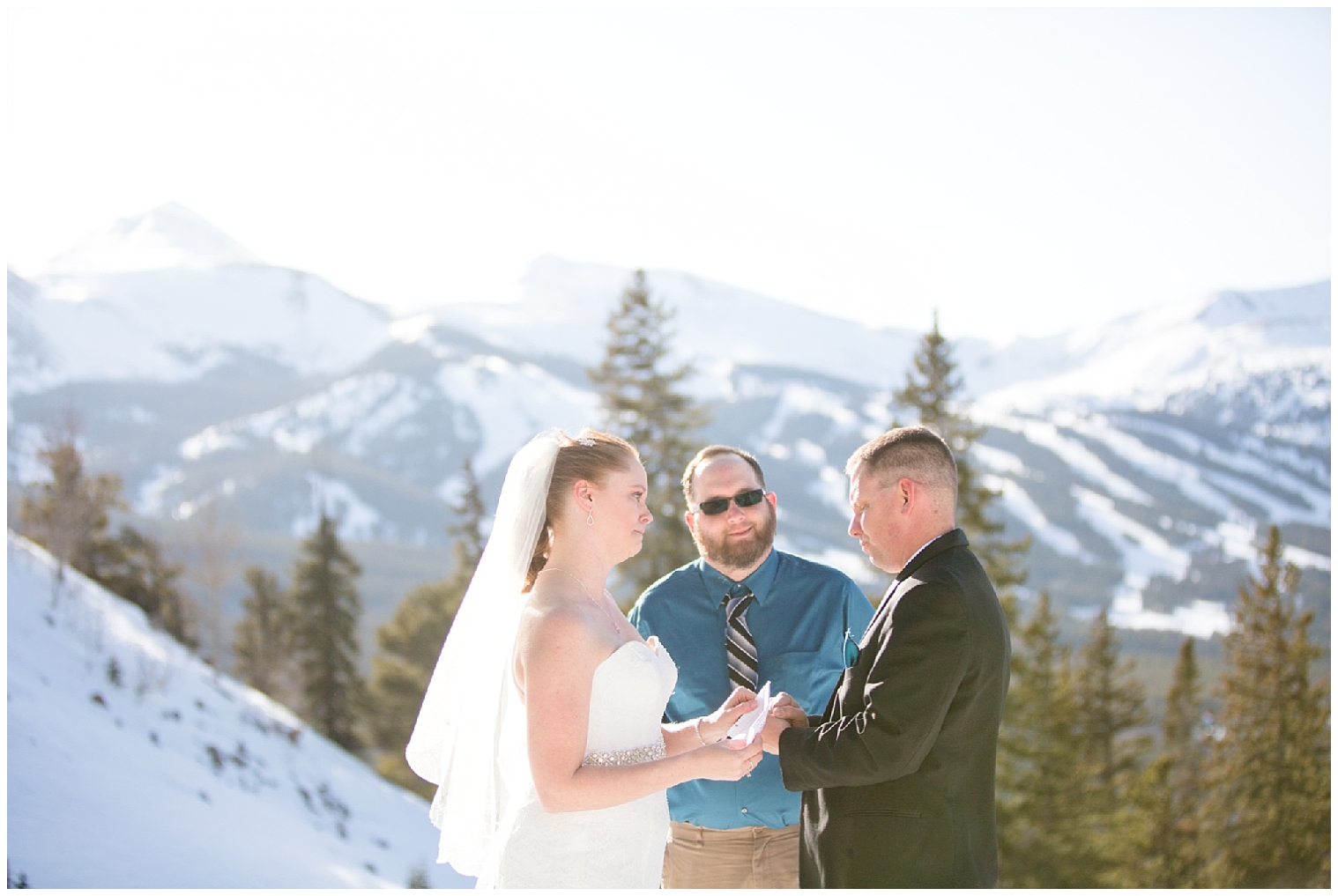 The wedding couple stand at the altar at their Colorado mountain elopement ceremony.