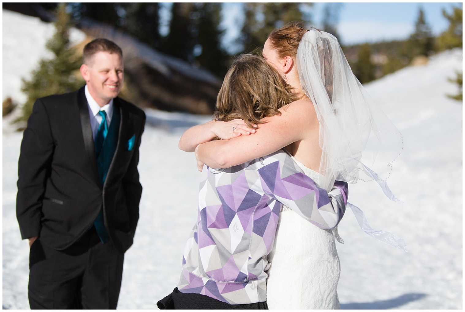 Bride hugs her daughter during a Boreas Pass Breckenridge elopement.