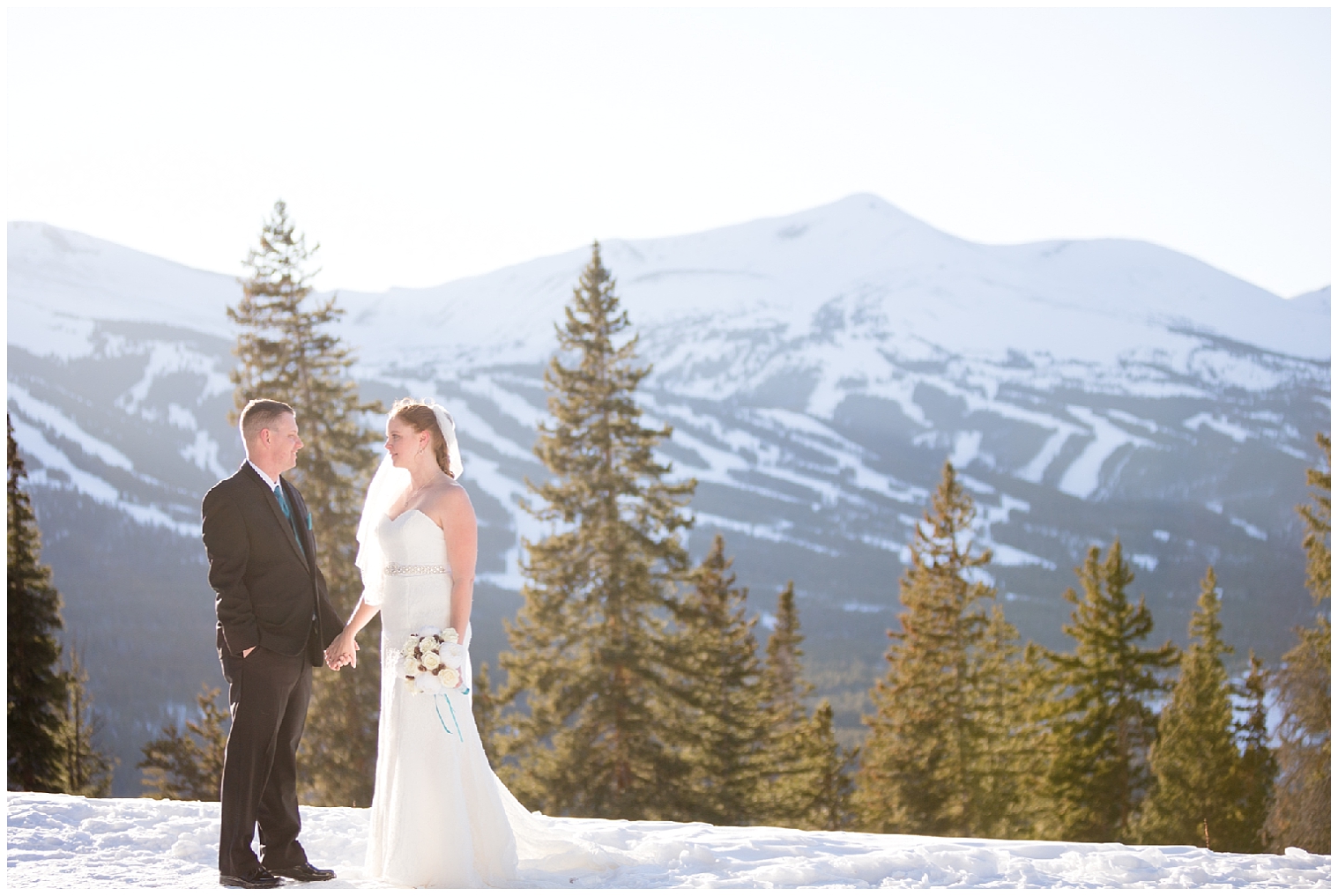 Boreas Pass elopement couple hold hands on top of a mountain.
