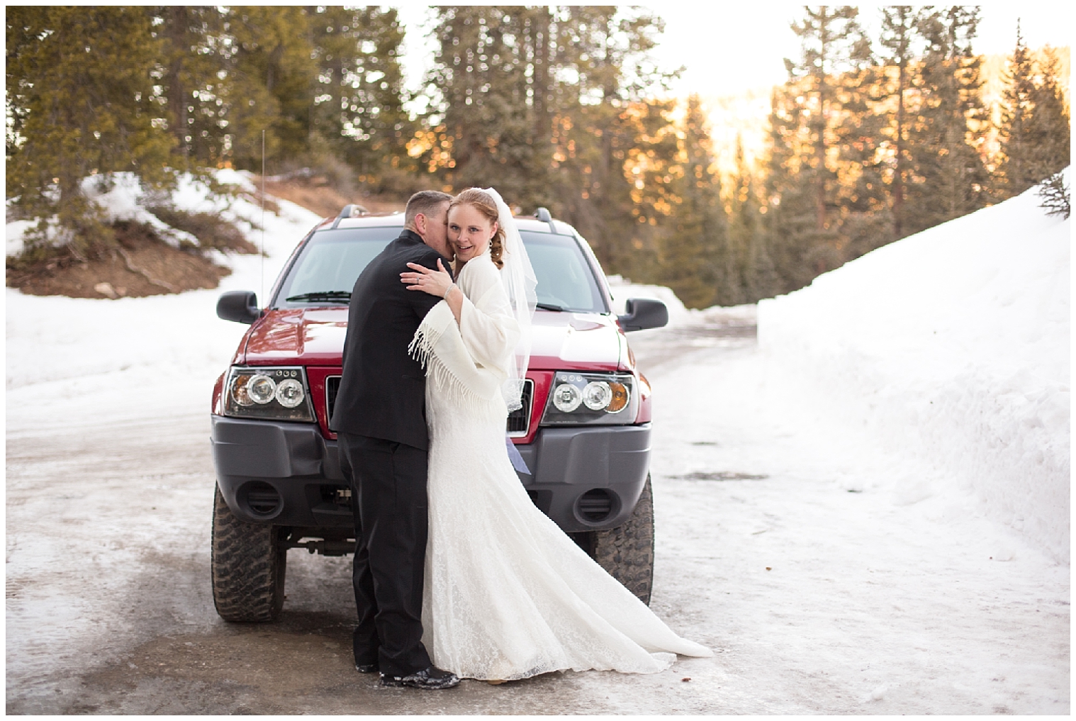 The wedding couple stand together in front of the groom's jeep for portraits at their Breckenridge elopement.