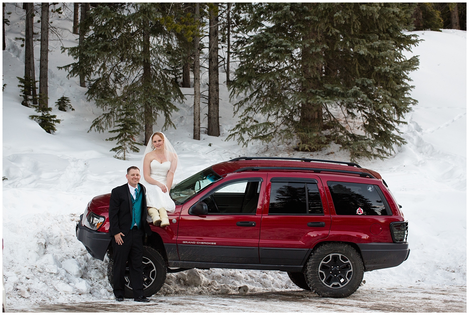 Bride sits on her groom's jeep at their snowy Boreas Pass Breckenridge elopement.