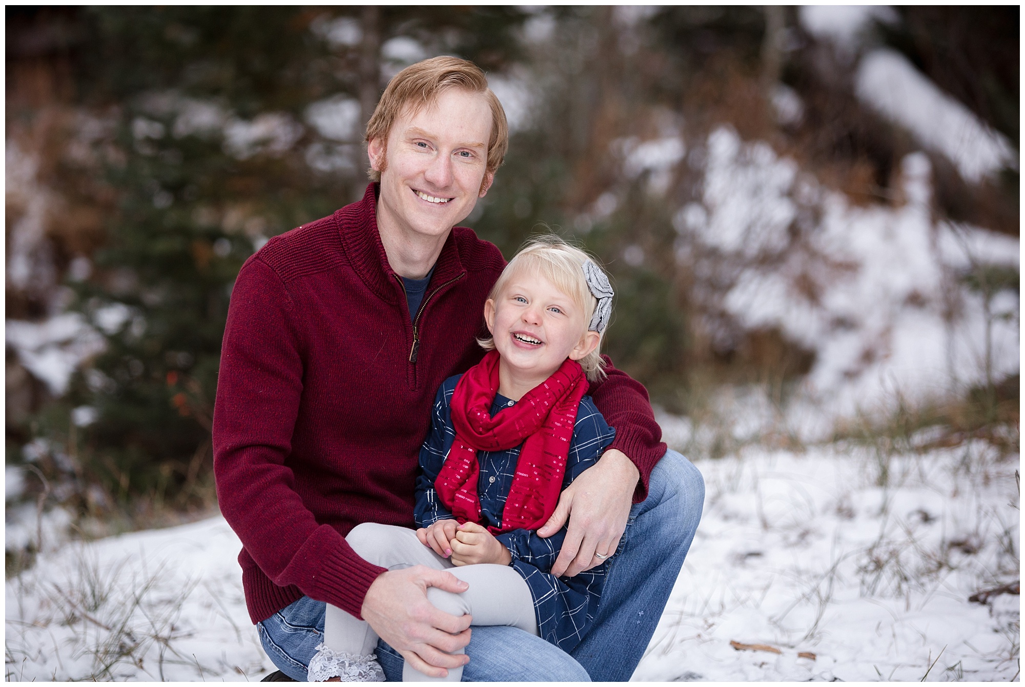 Photo of a dad with his daughter during a winter Colorado mountain family photo session.