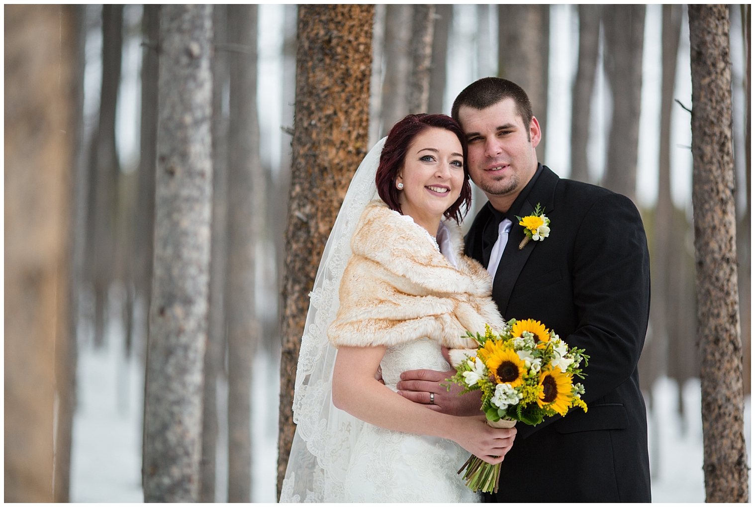 The bride and groom pose for portraits at their ski resort wedding at Sevens.