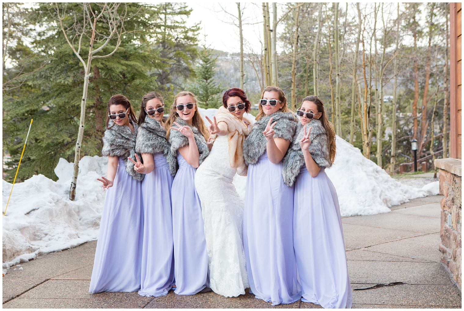 Fun portrait of the bride with her bridesmaids at a winter wedding at Sevens.