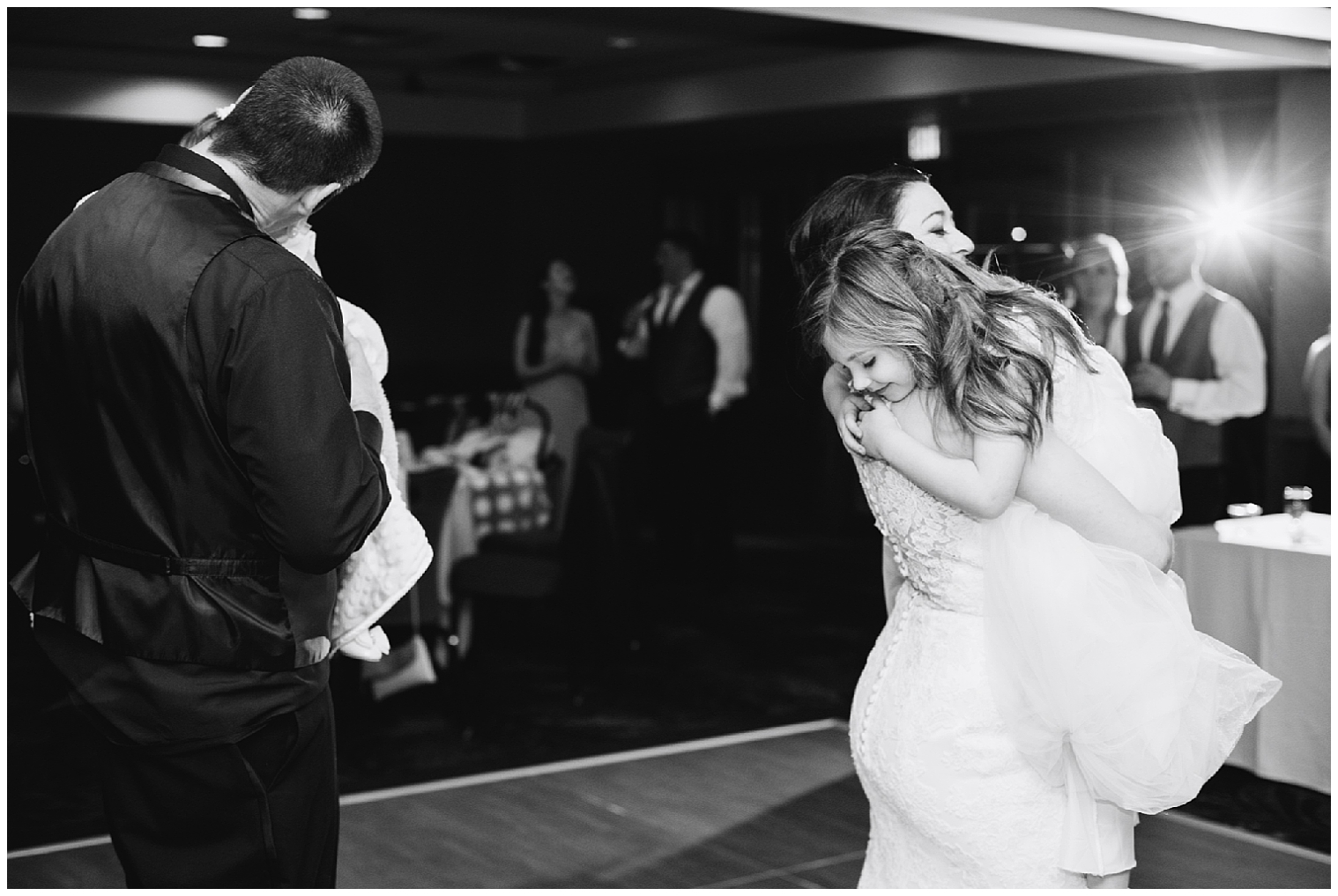 The bride and groom dance with their daughters at their Breckenridge mountain wedding.