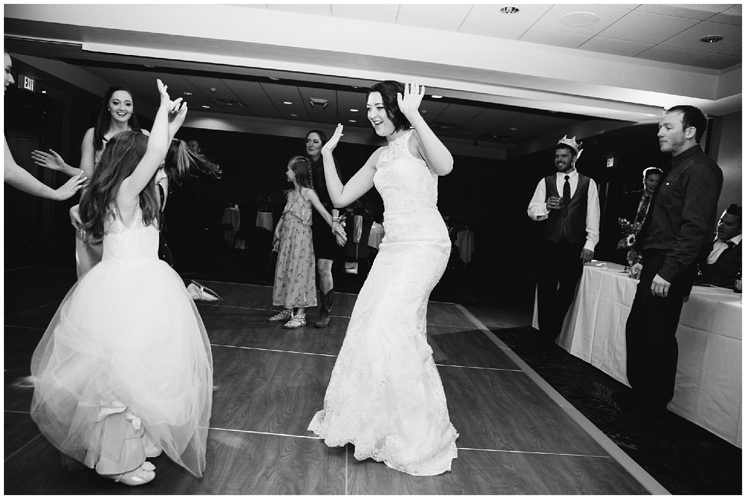 The bride dances with her daughter and guests at her Sevens wedding.