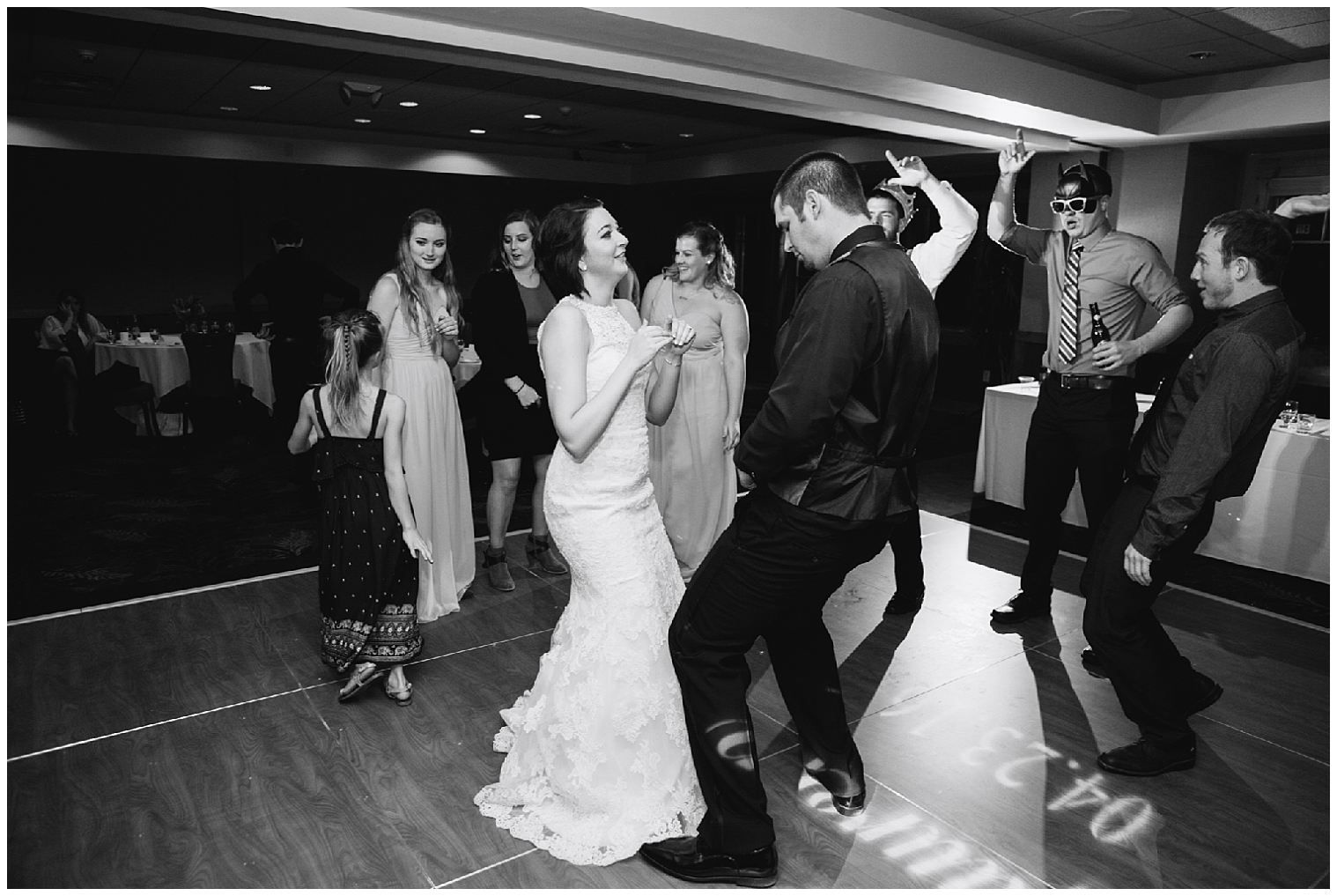 The bride and groom dance with their guests at their Sevens in Breckenridge wedding reception.