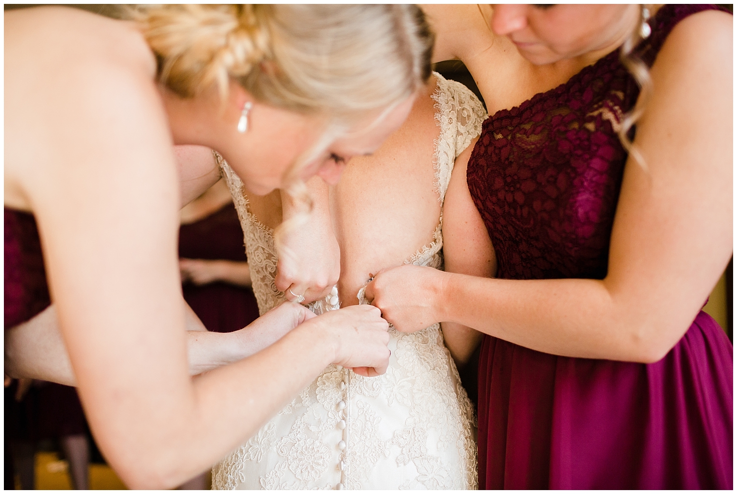 Bridesmaids help the bride into her wedding dress on her Copper Mountain wedding day.