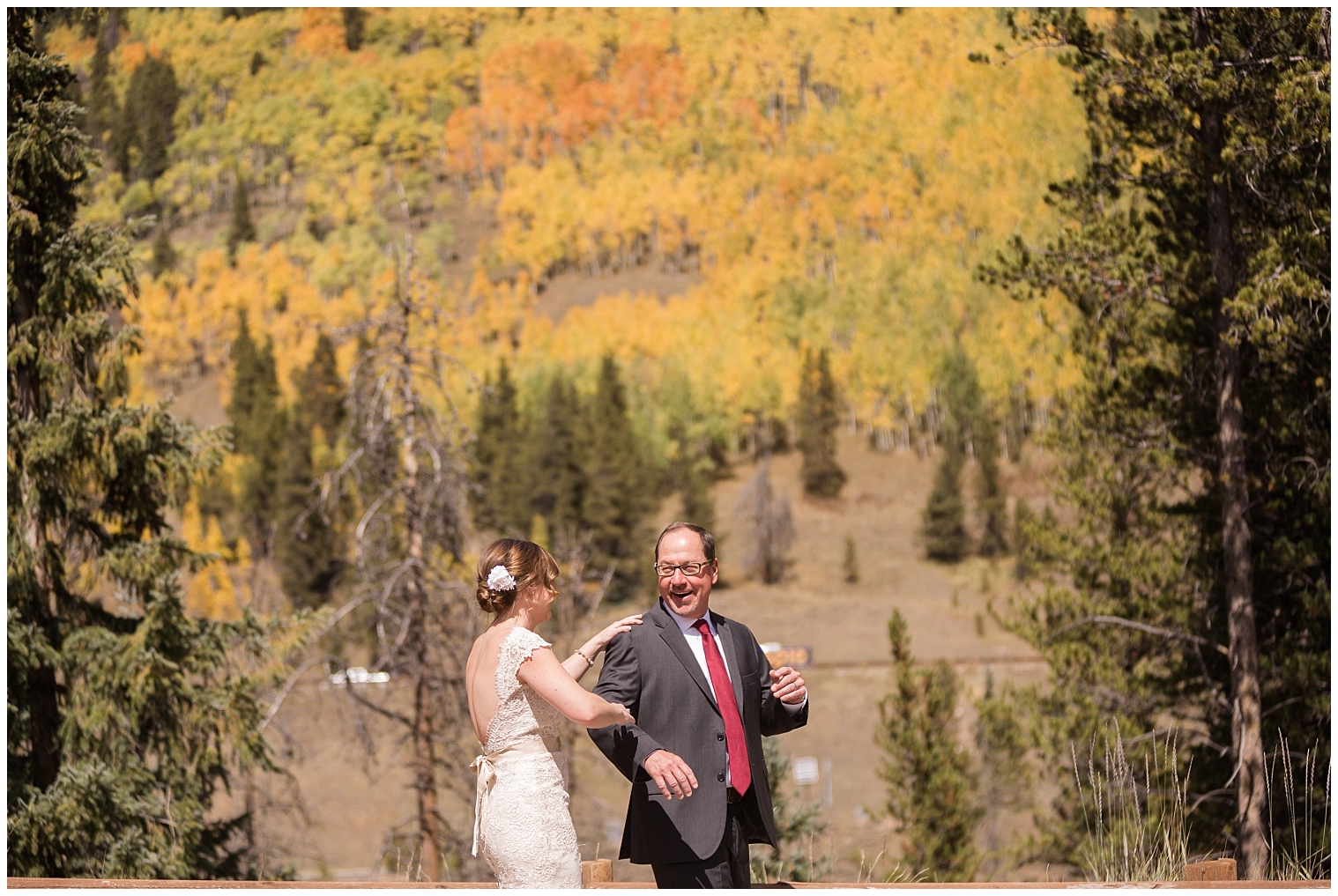 Father of the bride and the bride have a father-daughter first look at her Colorado mountain wedding.