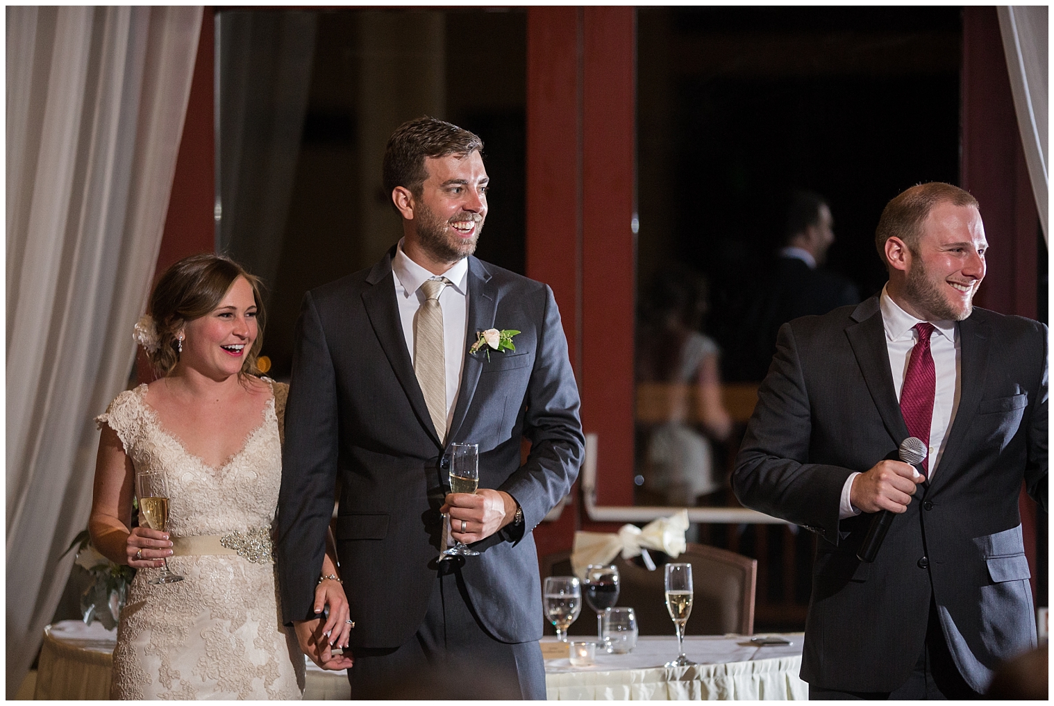 The wedding couple smiles during toasts at their Copper Mountain wedding ceremony.