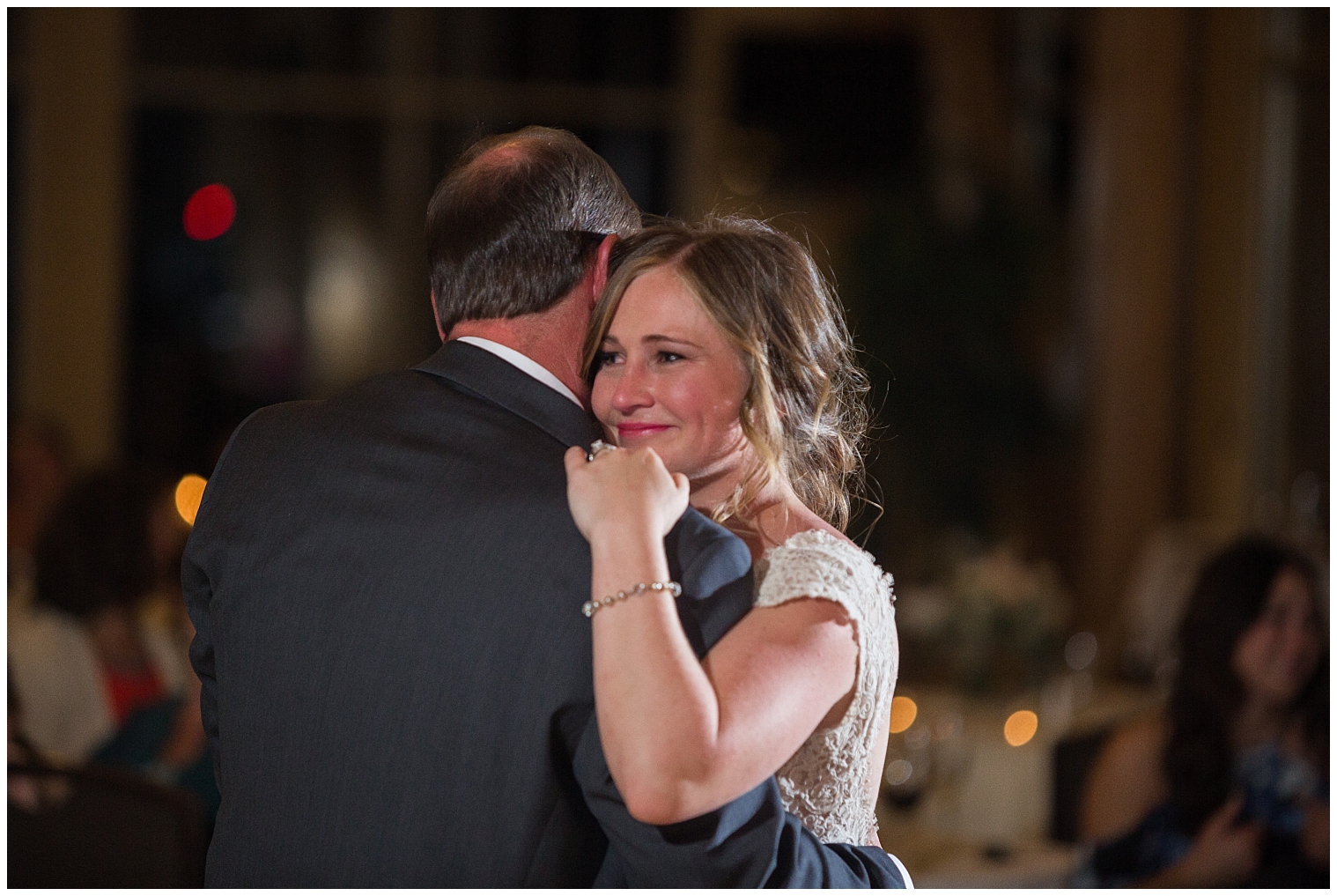 At her Copper Mountain wedding reception, the bride dances with her father in the father-daughter dance.