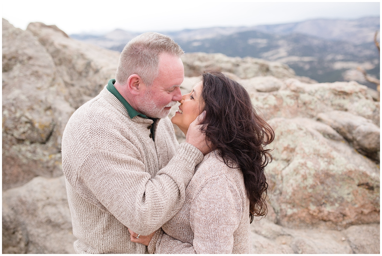 Man goes in for a kiss from his fiance during their Breckenridge engagement photos.