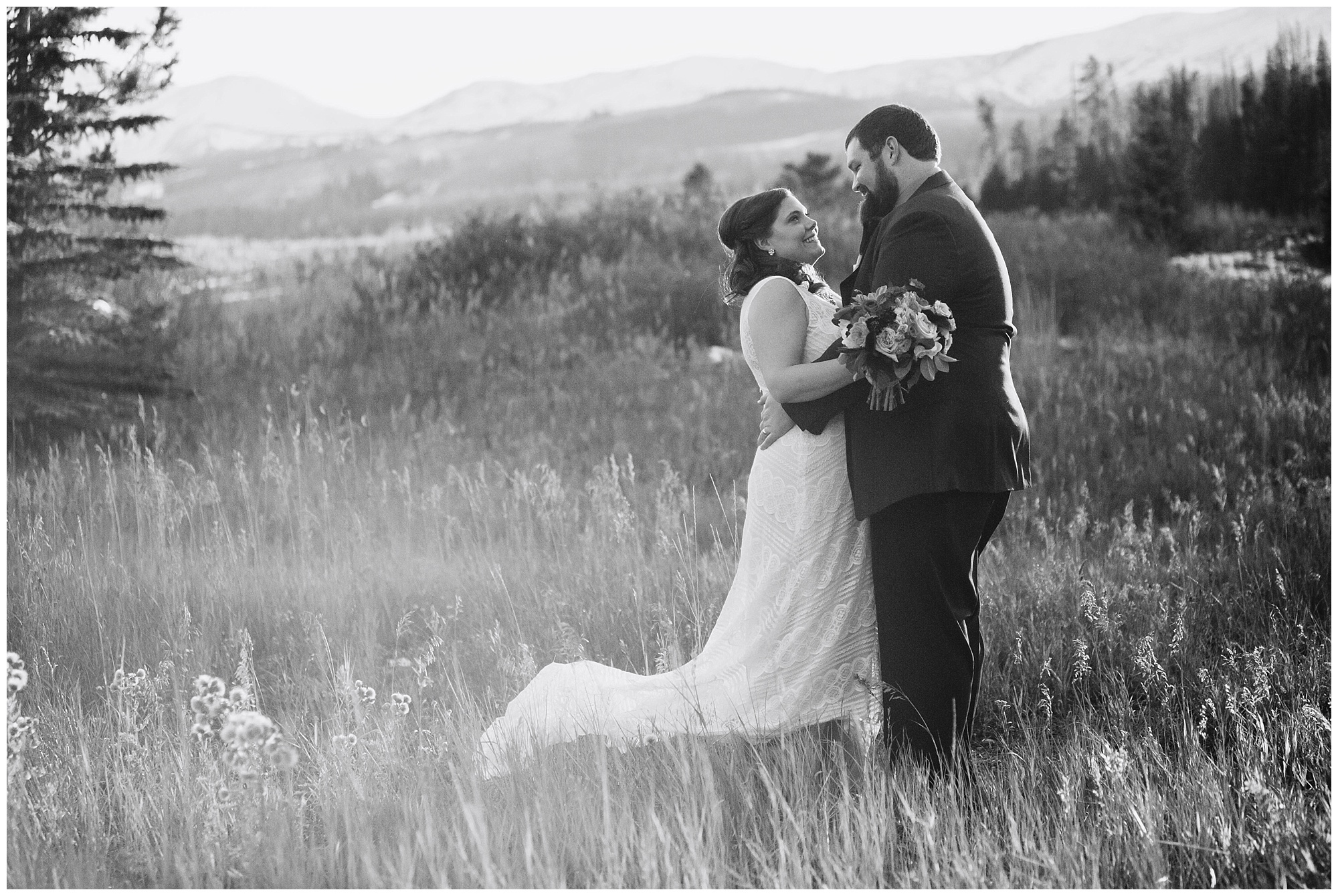Black and white photo of a bride and groom by a Colorado mountain elopement photographer.