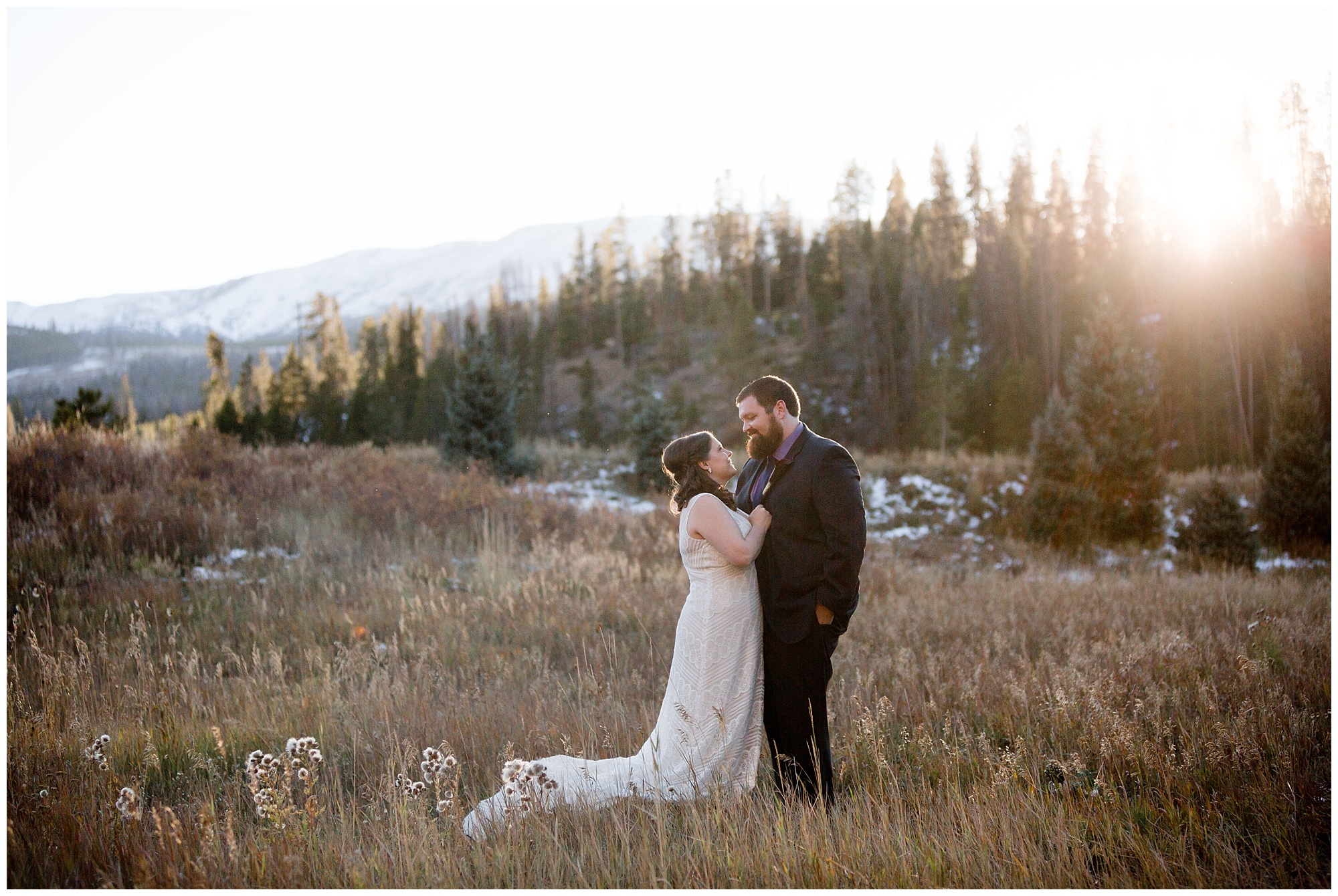 At their Colorado mountain elopement portraits, the bride and groom embrace.