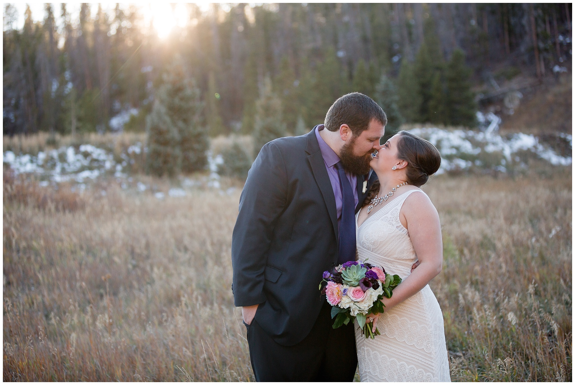 The bride and groom lean in for a kiss at their Colorado mountain elopement.