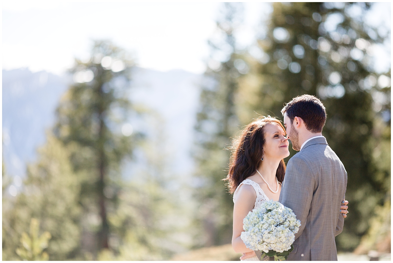 The wedding couple lean in for a kiss at their Colorado mountain elopement.