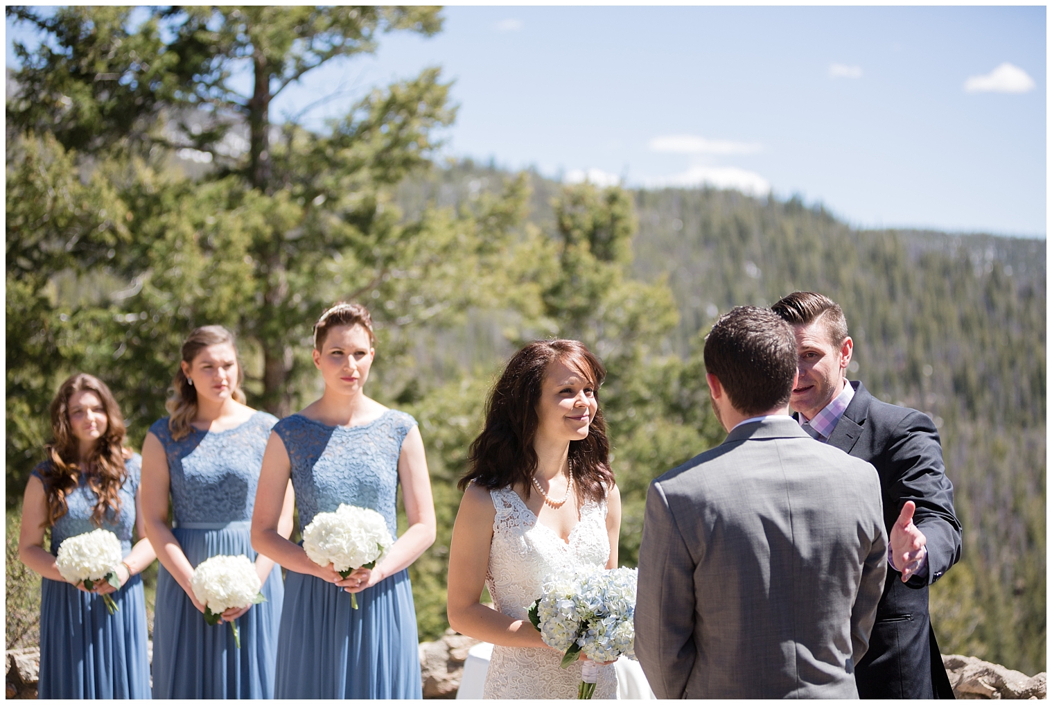 Bride smiles up at her groom during their Colorado mountain intimate wedding.