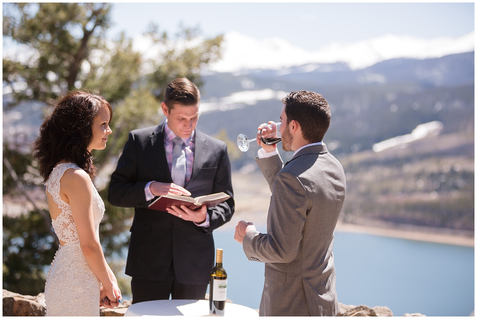 Groom drinks wine during a wine unity ritual at his Breckenridge elopement.