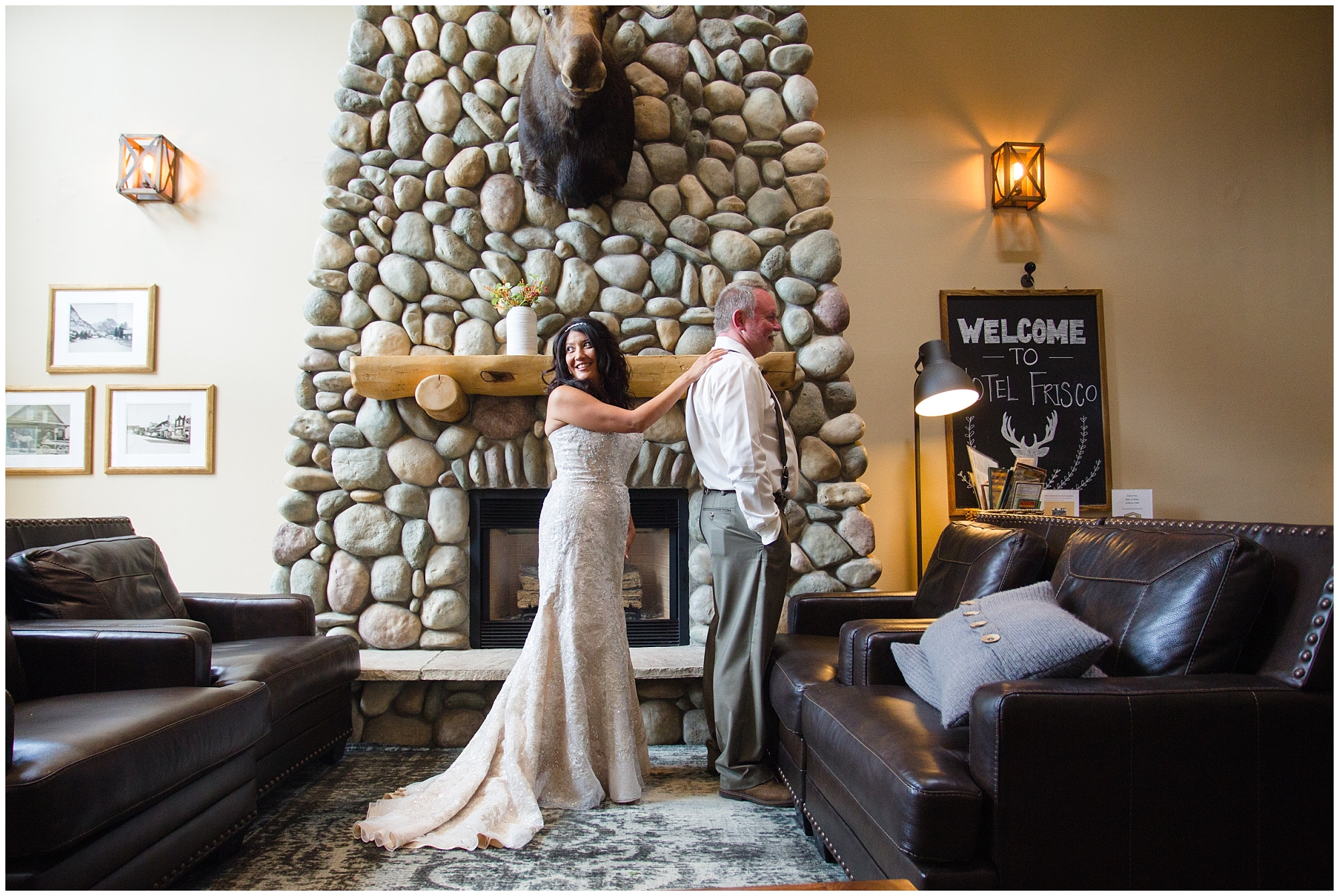 At a Colorado mountain wedding, the bride approached her groom for their first look inside a cabin.