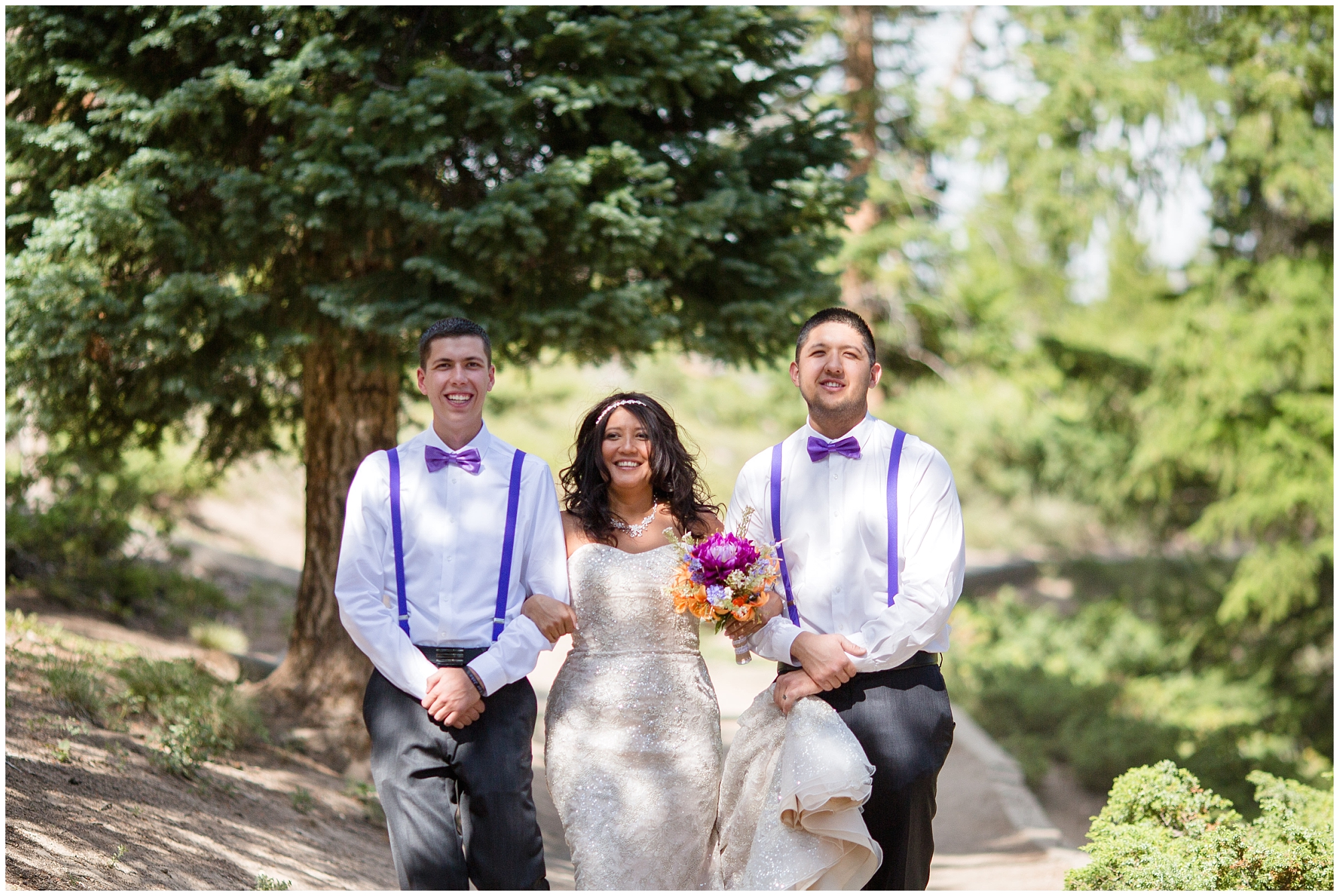 Bride is walked down the aisle by her sons at her Sapphire Point wedding.