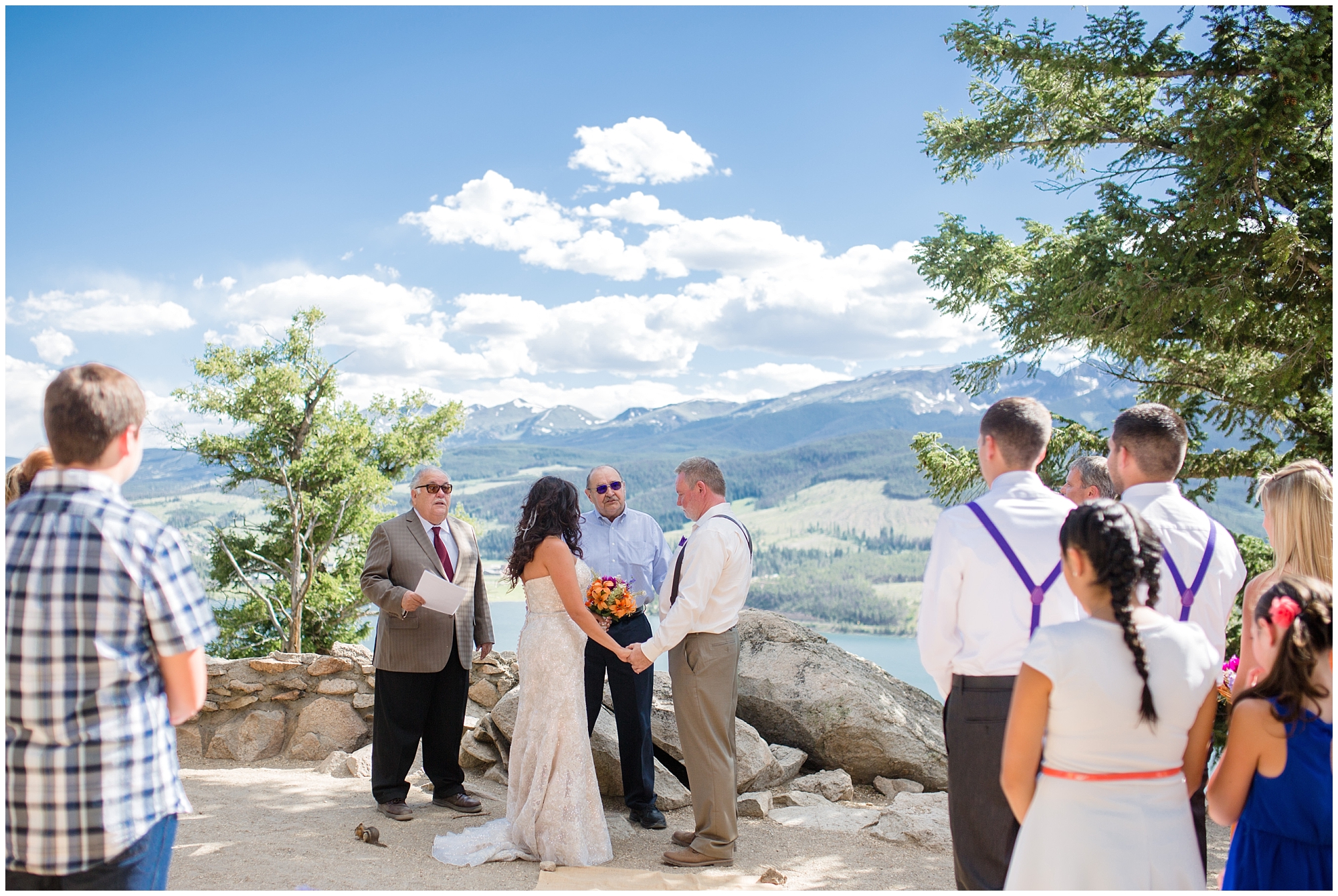 Bride and groom stand at Sapphire Point during their Colorado mountain wedding ceremony.