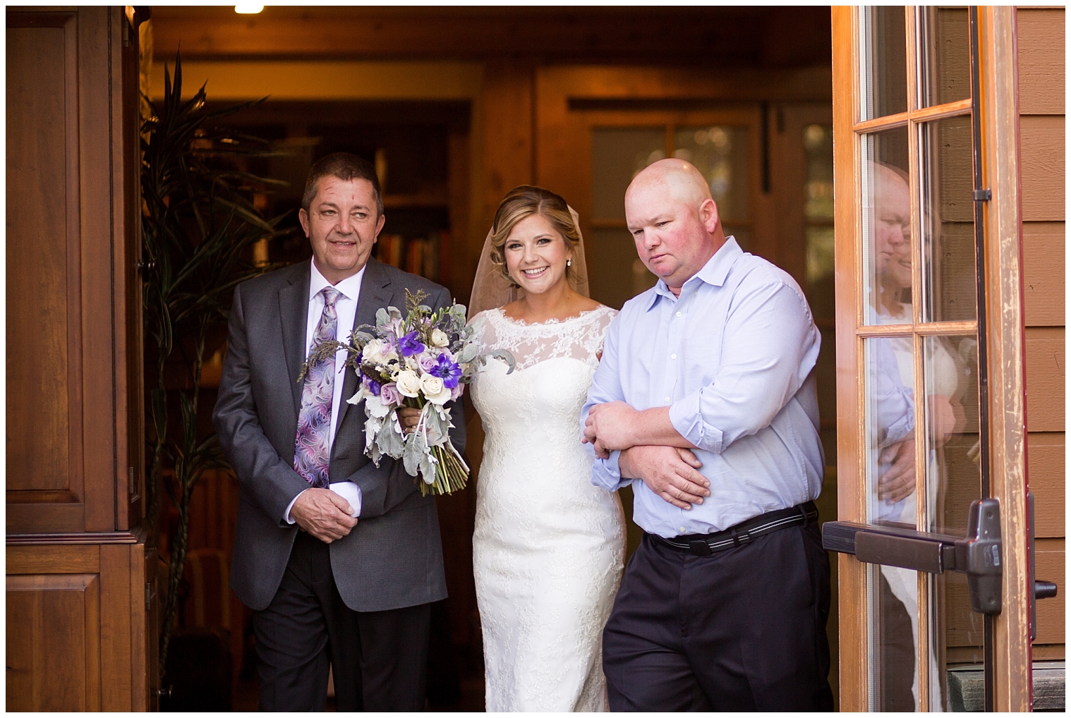 Bride is walked down the aisle by both her fathers at her Breckenridge mountain wedding.