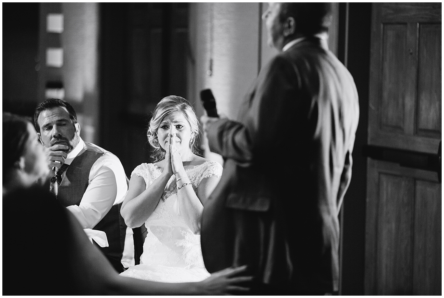 Bride cries during an emotional toast at her Mountain Thunder Lodge wedding reception.