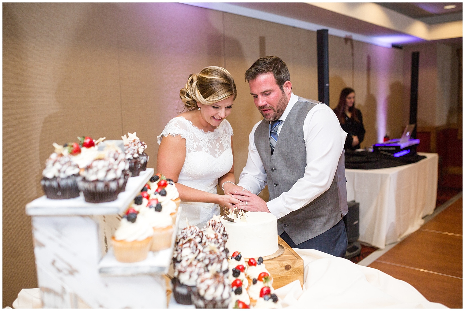 The bride and groom cut their cake at their Breckenridge Colorado wedding reception.
