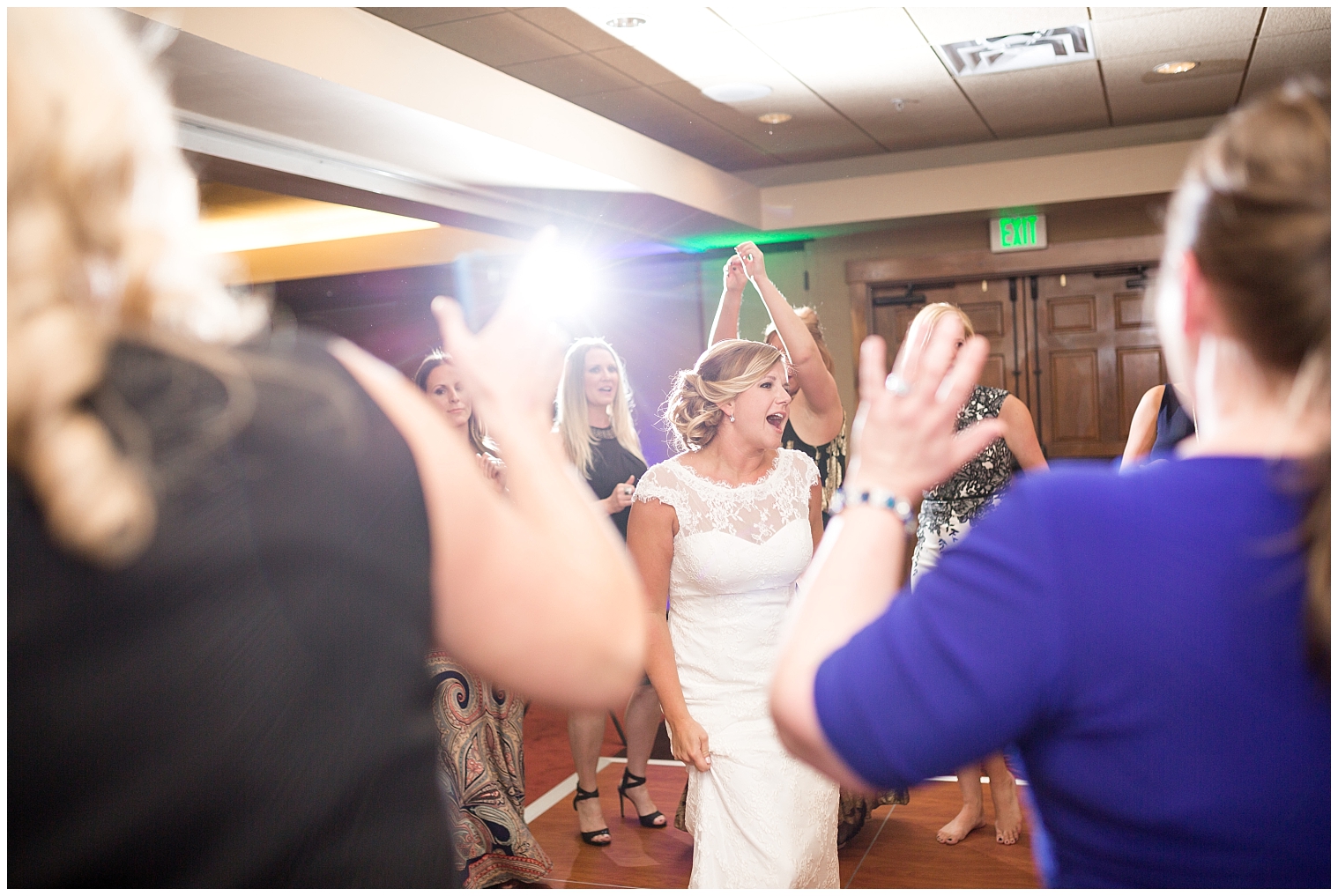 Bride dances with her guests at her Mountain Thunder Lodge wedding reception.