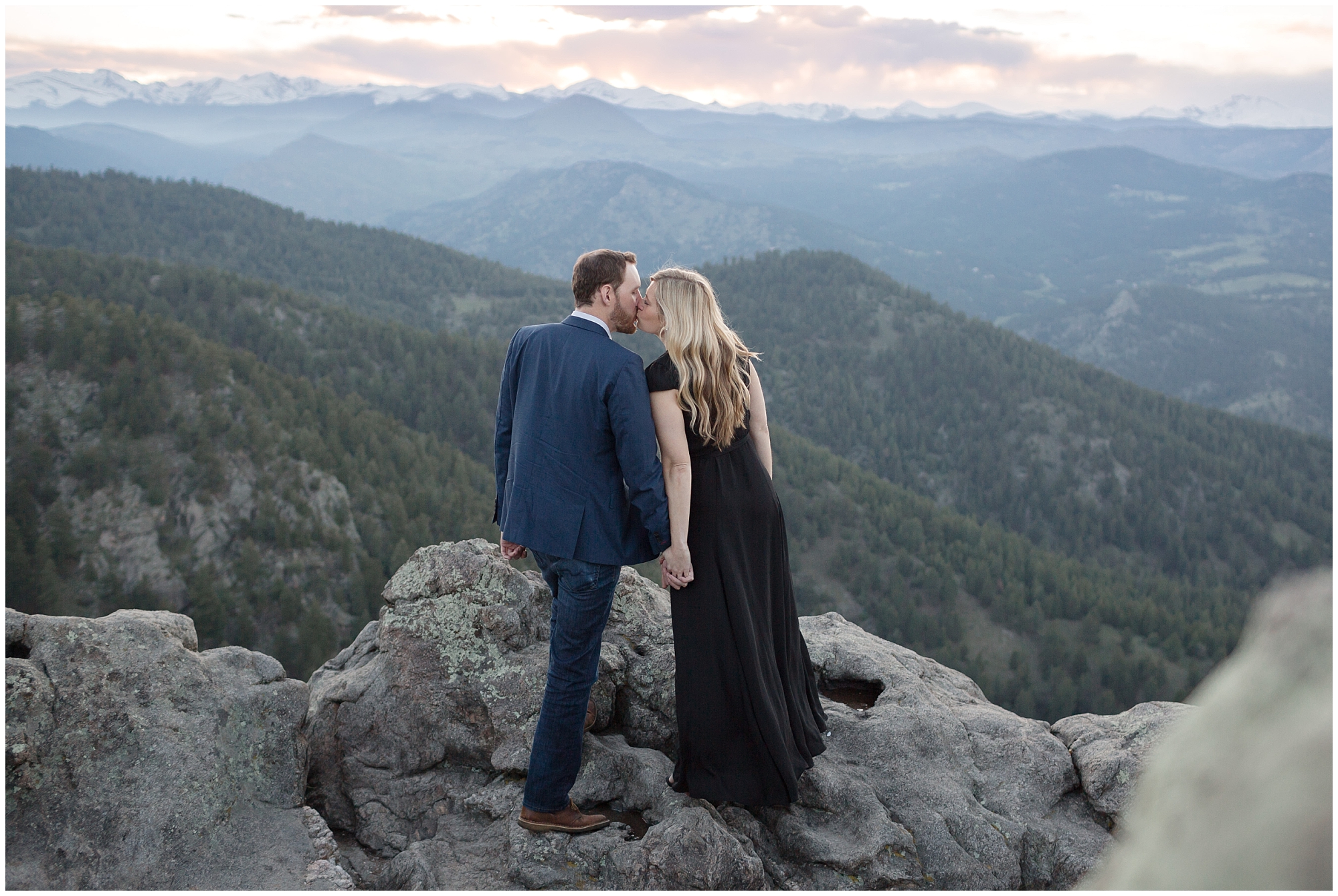 Couple kisses during their engagement photos with a Colorado mountain wedding photographer.