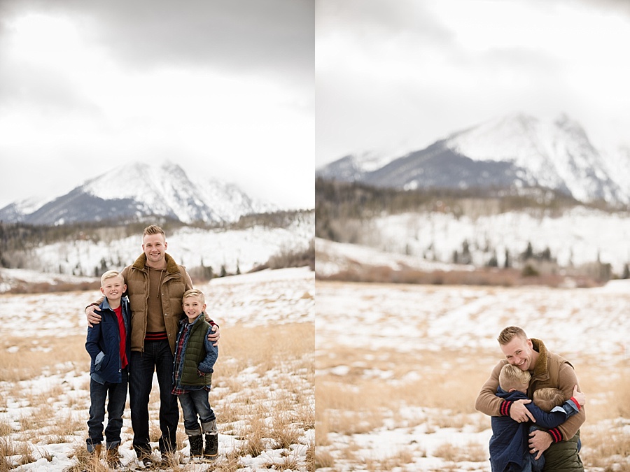 father poses with his two sons in snowy Breckenridge