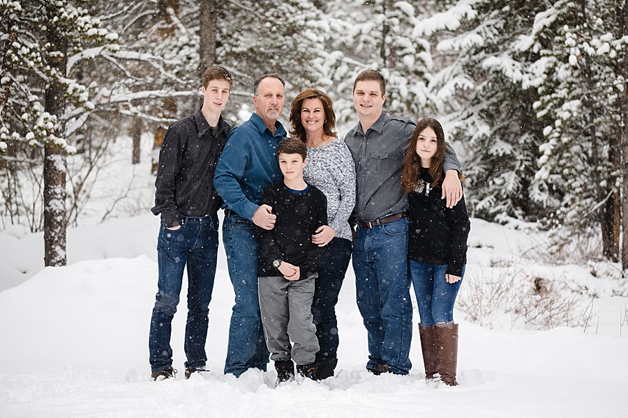 family poses in snow in Breckenridge Colorado 