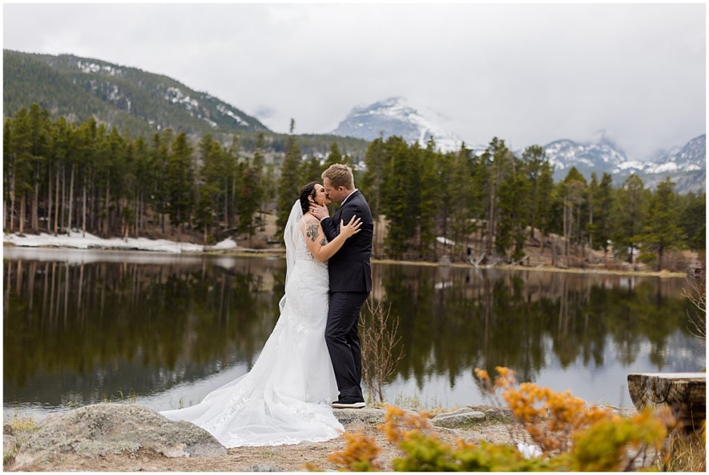 Bride and groom together at lake Sprague during elopement at Rocky Mountain National Park