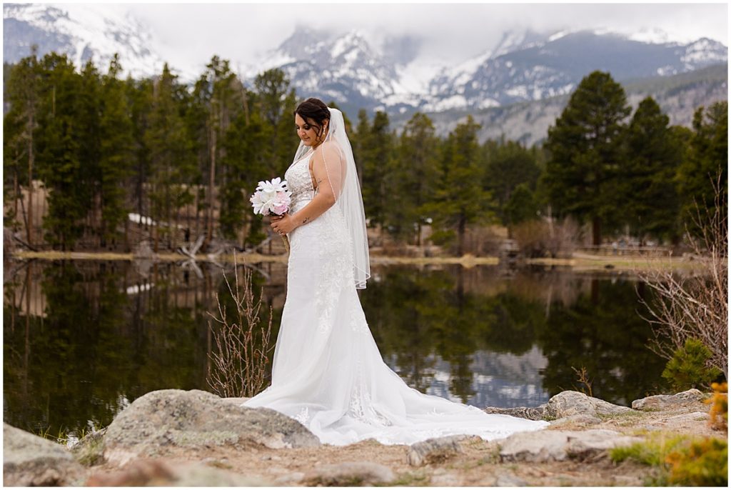 Bride at lake Sprague during elopement at Rocky Mountain National Park
