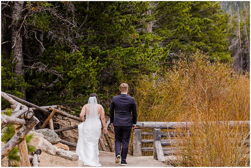 Bride and groom on trail at Rocky Mountain National Park