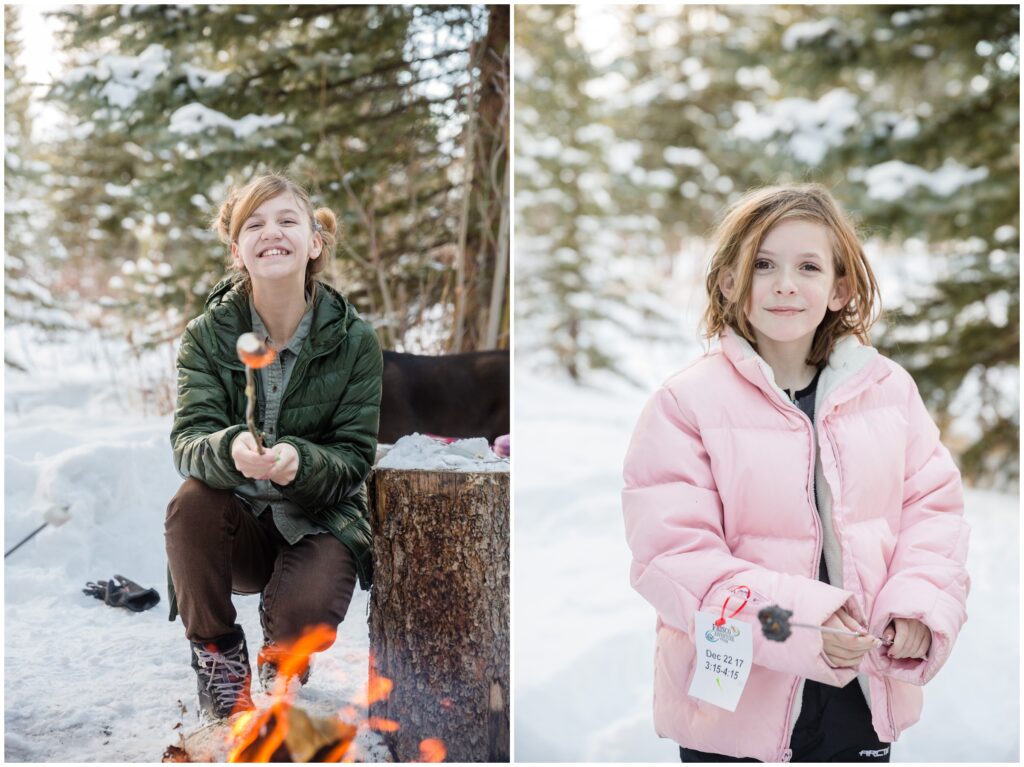 two girls toasting marshmallows by the fire in Breckenridge