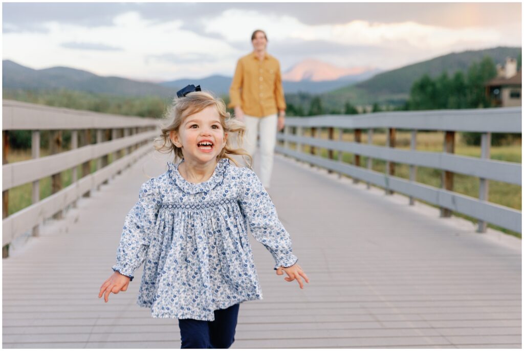 Toddler running on bridge in Frisco